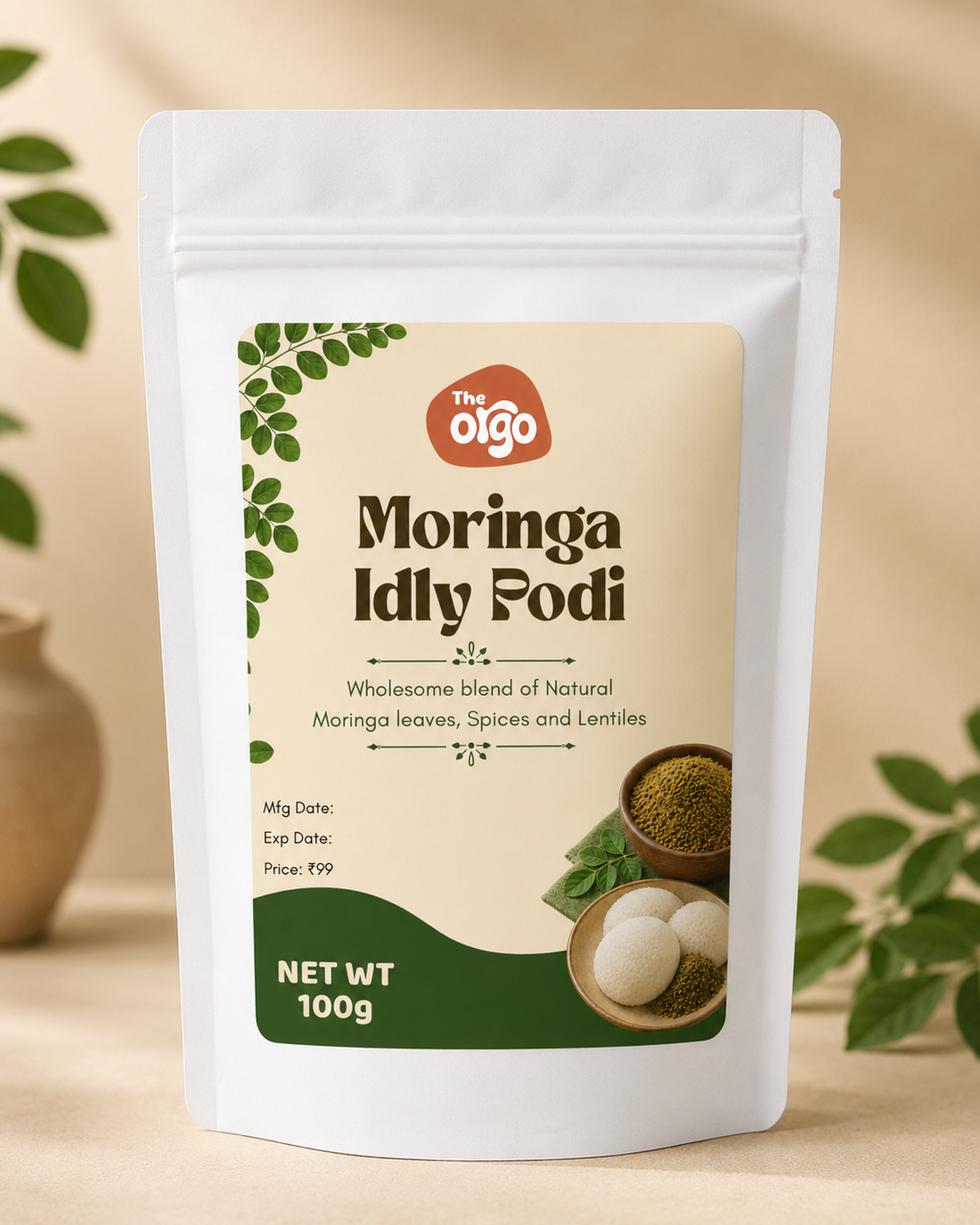 Jar of moringa idli podi (murungai keerai podi) served with idli and sesame oil